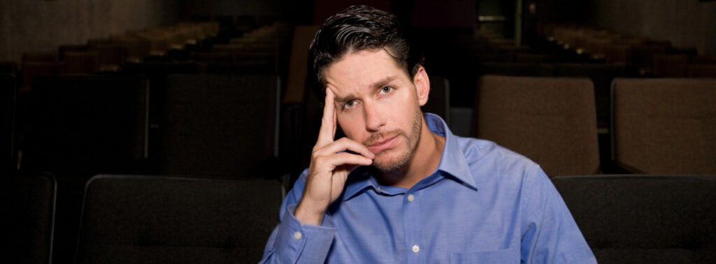 Can We Renegotiate Our Public Sector Contract? A man looks pensively into the middle distance, resting his head in his hand.